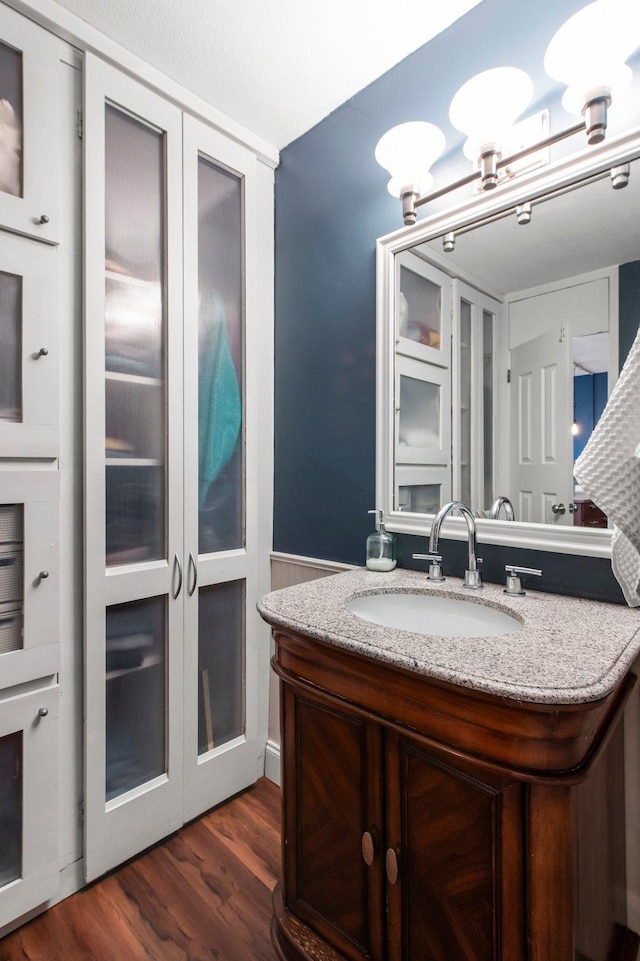 bathroom featuring vanity and wood-type flooring