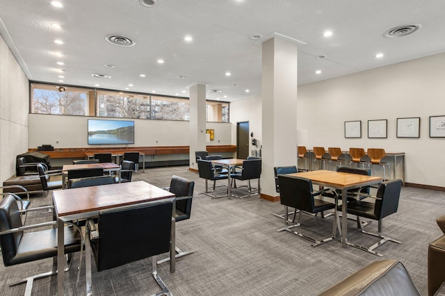 dining room featuring carpet flooring