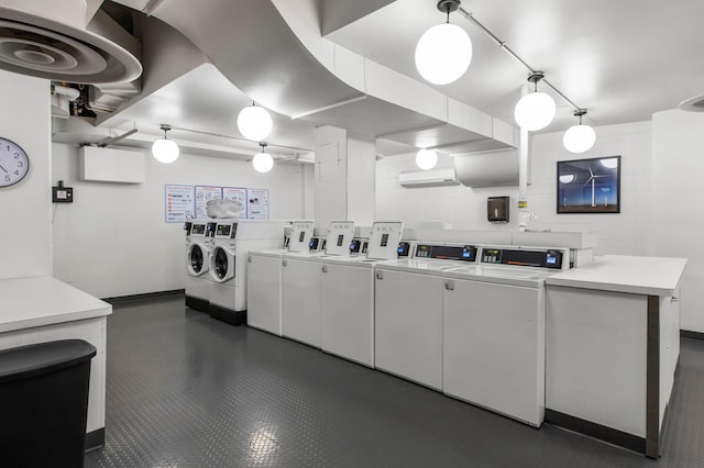 laundry room with washing machine and clothes dryer