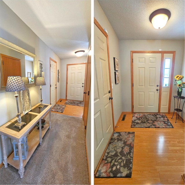 foyer with visible vents, baseboards, a textured ceiling, and wood finished floors