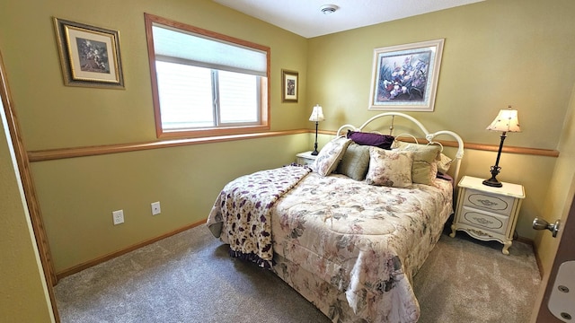 carpeted bedroom with baseboards