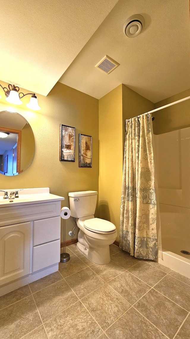 bathroom featuring vanity, a shower with curtain, visible vents, tile patterned floors, and toilet