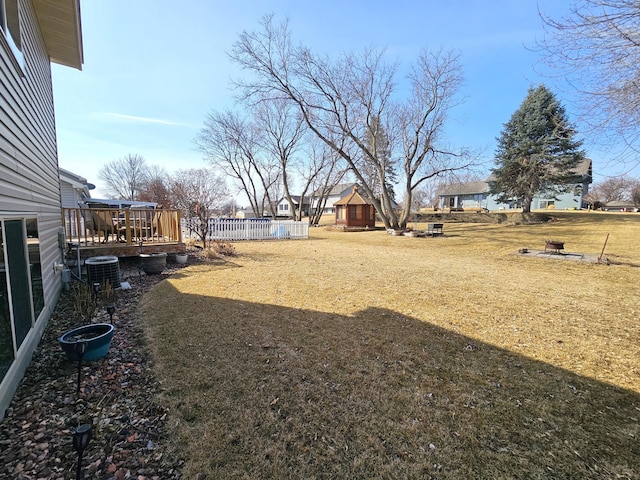 view of yard with a wooden deck and fence