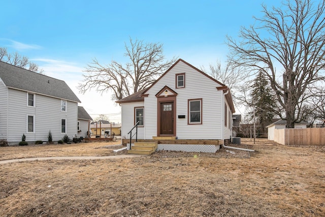 view of front of property featuring central AC and a front lawn