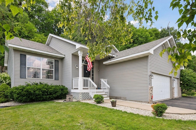 view of front of house with a garage and a front lawn