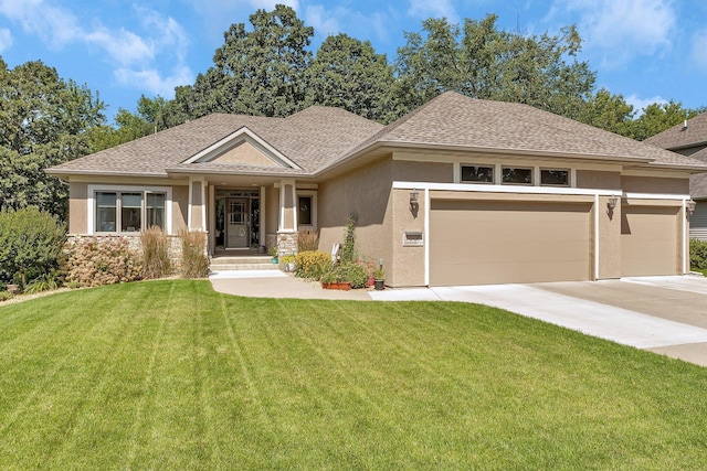 view of front of property with a garage and a front yard