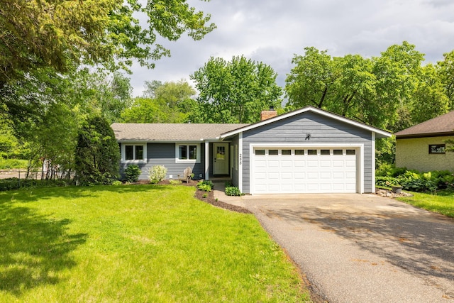 single story home with a garage and a front yard