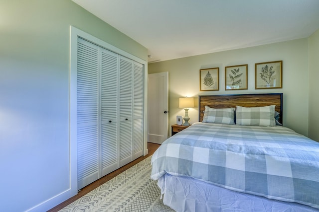 bedroom featuring hardwood / wood-style flooring and a closet