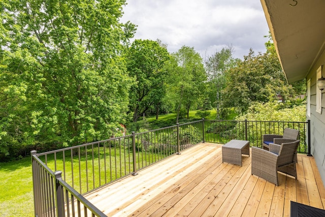 wooden terrace with a yard and outdoor lounge area