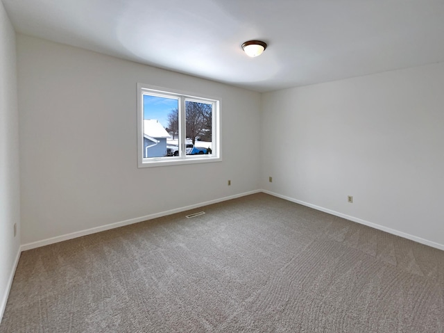 unfurnished room featuring carpet floors