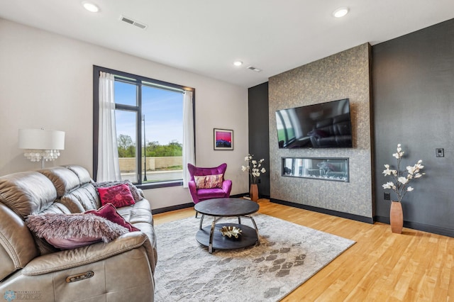 living room featuring hardwood / wood-style floors and a fireplace