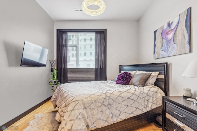 bedroom featuring hardwood / wood-style floors