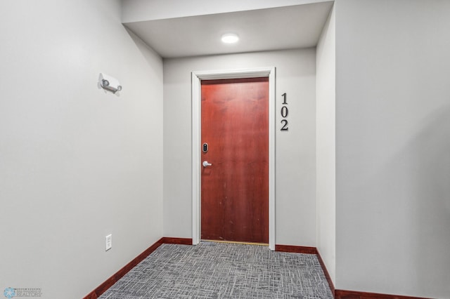 entryway featuring carpet floors