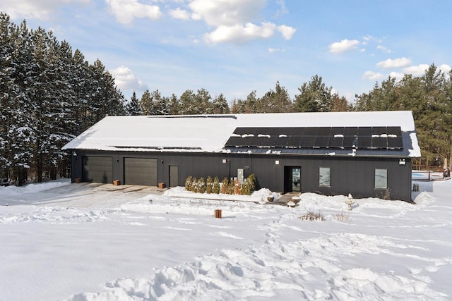 1325 State Highway 27, Ladysmith, WI 54848 - snow covered back of property featuring roof mounted solar panels