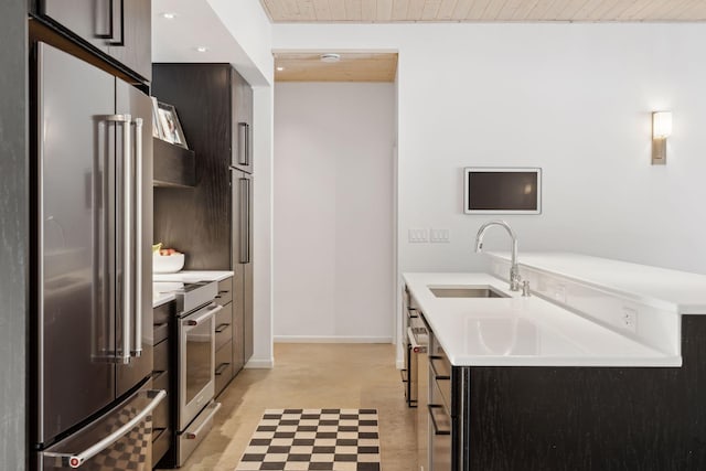 1325 State Highway 27, Ladysmith, WI 54848 - kitchen with stainless steel appliances, light countertops, modern cabinets, a sink, and wood ceiling