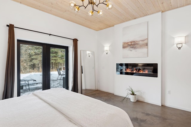 1325 State Highway 27, Ladysmith, WI 54848 - bedroom with french doors, a chandelier, access to outside, concrete floors, and wood ceiling