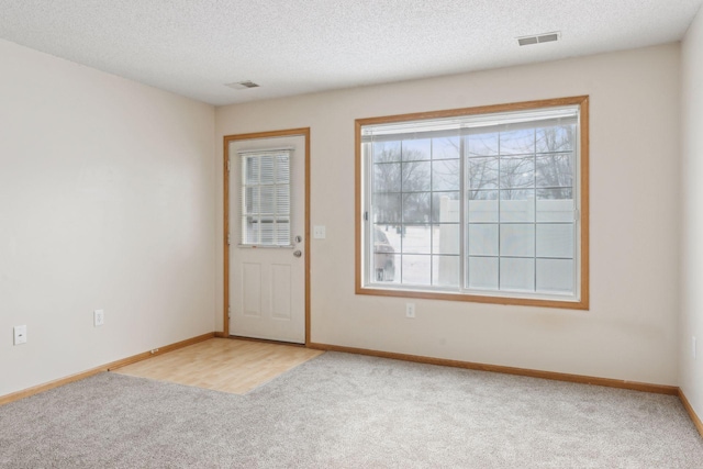 interior space featuring a textured ceiling