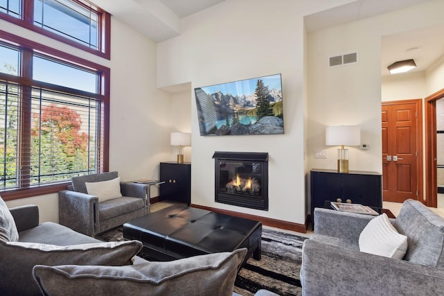 living room with a towering ceiling