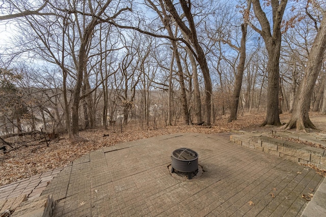 view of patio / terrace featuring a fire pit