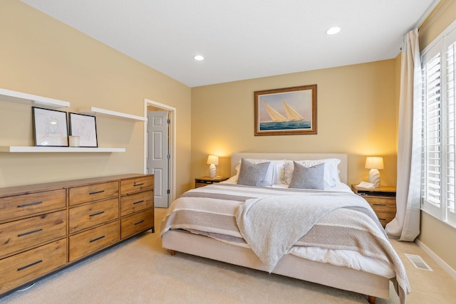 bedroom with light colored carpet