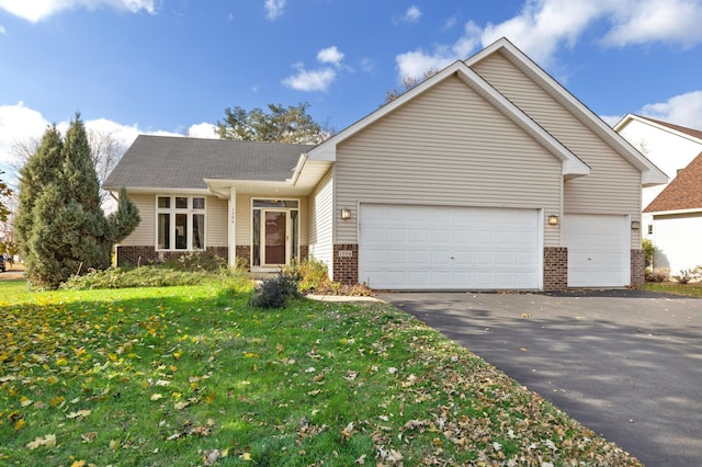 view of front of home with a garage and a front yard