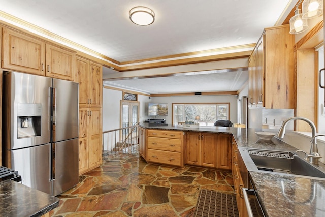 kitchen with sink, crown molding, kitchen peninsula, and stainless steel refrigerator with ice dispenser