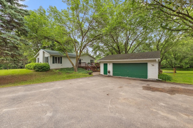8685 79th St NW, Corinna Twp, MN 55302 - view of front facade featuring a garage, an outbuilding, and a front yard