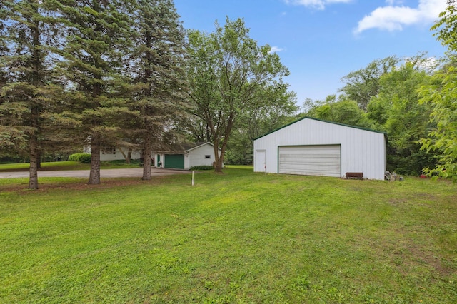8685 79th St NW, Corinna Twp, MN 55302 - view of green lawn featuring an outbuilding and a garage