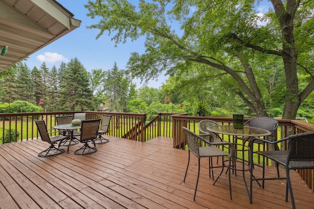 8685 79th St NW, Corinna Twp, MN 55302 - wooden deck featuring outdoor dining space and view of scattered trees