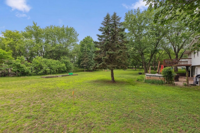 8685 79th St NW, Corinna Twp, MN 55302 - view of grassy yard with a deck