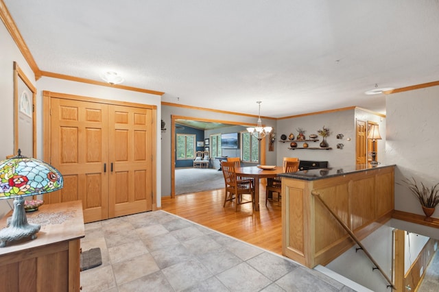8685 79th St NW, Corinna Twp, MN 55302 - entryway featuring crown molding, a chandelier, and light wood finished floors