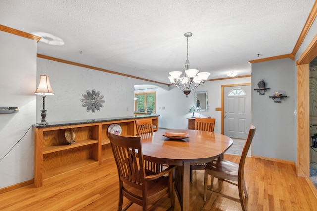 8685 79th St NW, Corinna Twp, MN 55302 - dining room with ornamental molding, a textured ceiling, light wood-style flooring, and a chandelier