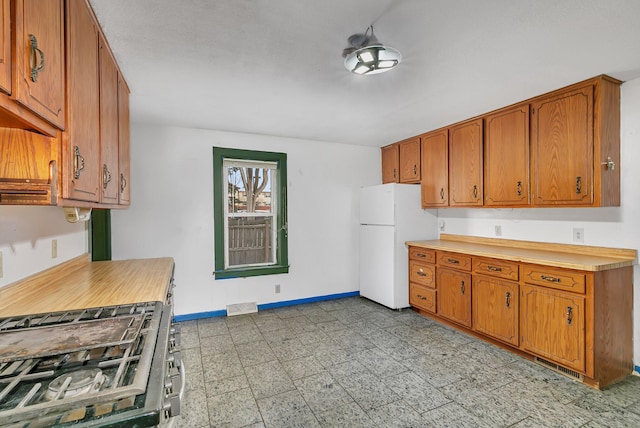 kitchen featuring white refrigerator