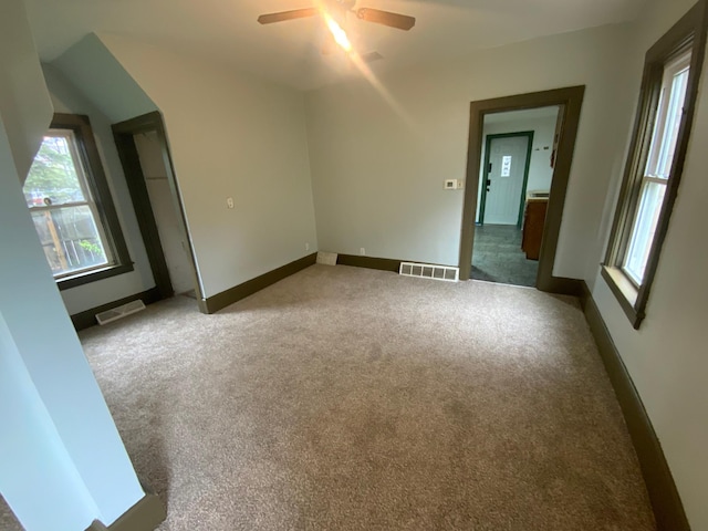 428 10th Ave N, Saint Cloud, MN 56303 - spare room featuring carpet, ceiling fan, and plenty of natural light