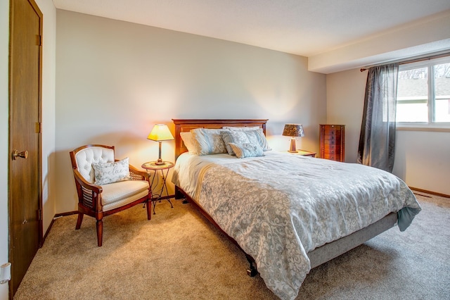 carpeted bedroom with baseboards