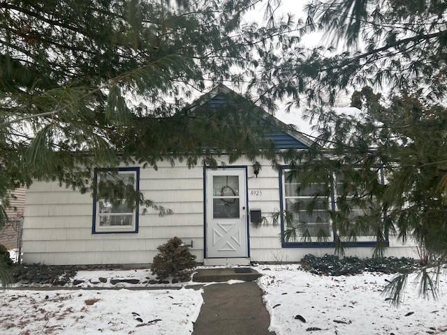 view of snow covered property entrance