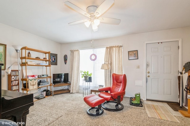 living room with light carpet and ceiling fan