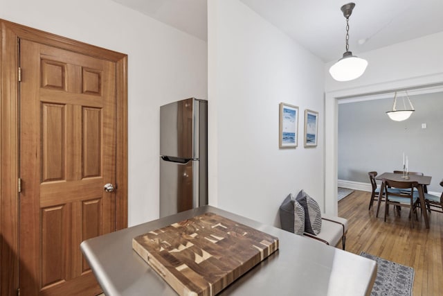 dining space featuring dark hardwood / wood-style floors