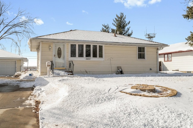 view of front of property featuring an outbuilding and a garage