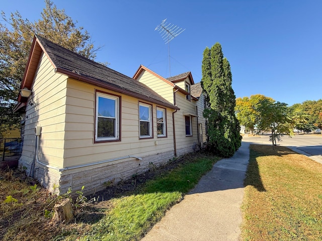 view of home's exterior featuring a lawn