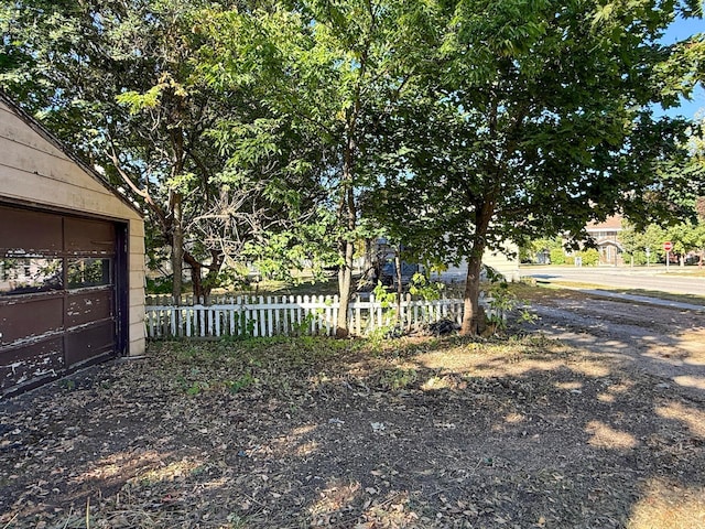 view of yard with an outbuilding and a garage