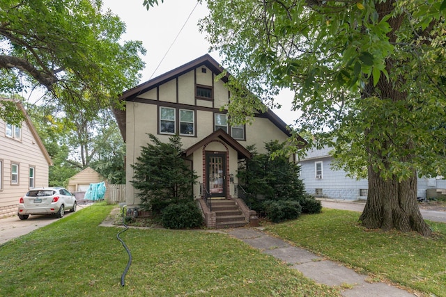 tudor house with a front yard