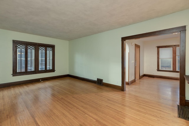 spare room with light wood-type flooring