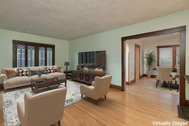 living room with light hardwood / wood-style floors