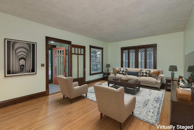 living room with light hardwood / wood-style floors