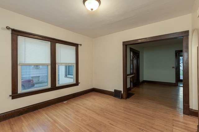 spare room with light hardwood / wood-style floors