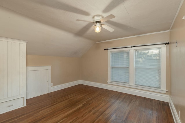 additional living space with vaulted ceiling, dark hardwood / wood-style floors, and ceiling fan