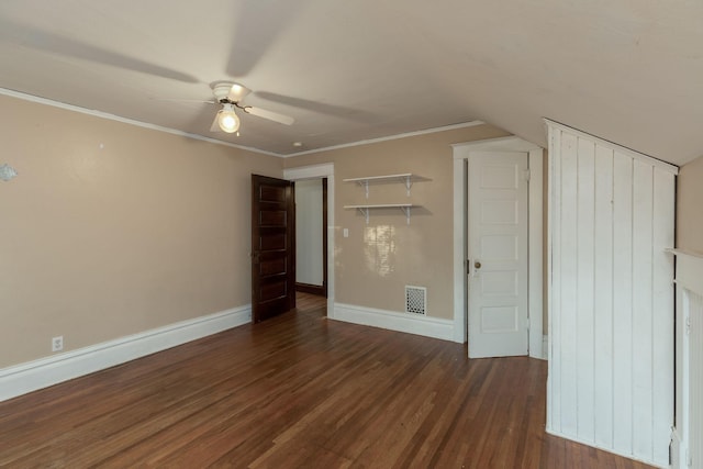 unfurnished bedroom with ornamental molding, ceiling fan, and dark hardwood / wood-style flooring