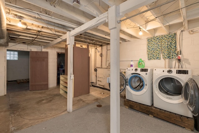 basement featuring washing machine and clothes dryer