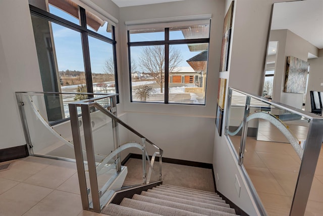 staircase featuring tile patterned floors